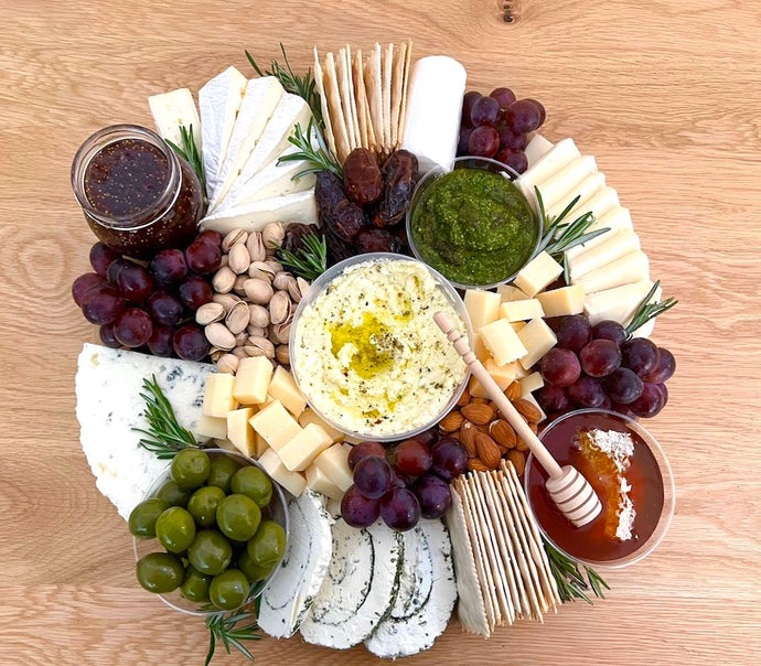 cheese platter, goat cheese, brie cheese, taleggio, le roule, honey, olives